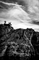 Rock cliffside with Soft Clouds Above